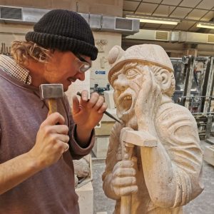 Picture shows Paul Synan with miner carving © Paul Synan - permission granted