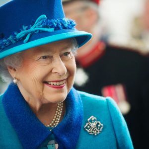 Her Majesty The Queen in a blue suit