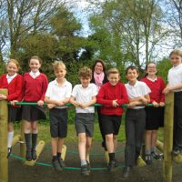 Children and teachers celebrate outstanding ofsted report