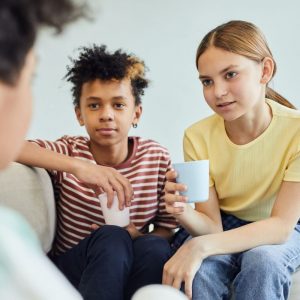 Children talking with cups