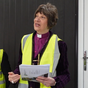 Bishop Rachel, wearing a high vis jacket, speaking to the gathered guests at the launch.