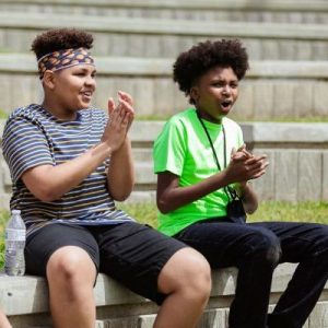 Two young people clapping