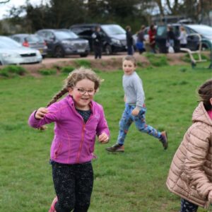 Children running around on a field