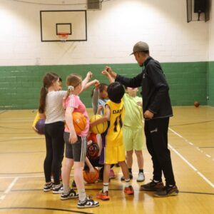 A team huddle on the basketball court