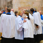 Clergy and Lay leaders share a hug